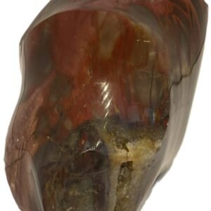 Hand carved polished carnelian flame sculpture featuring twisting ridges with deep mahogany red burnt orange tones and smoky chalcedony patches isolated on a white background